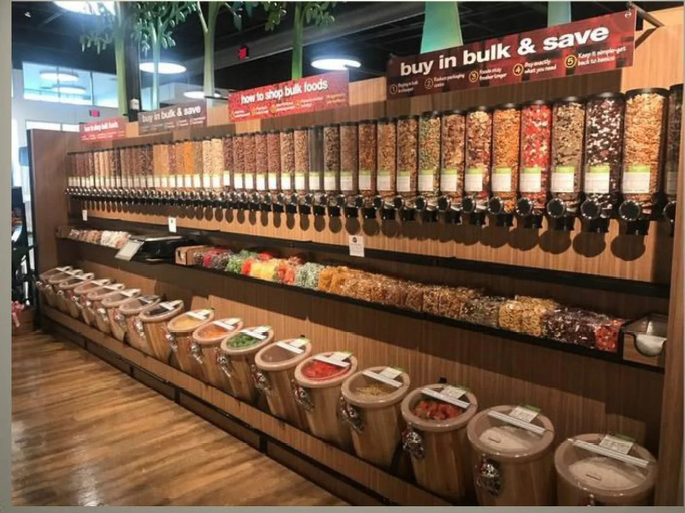 Clear dispensers filled with bulk foods in a market