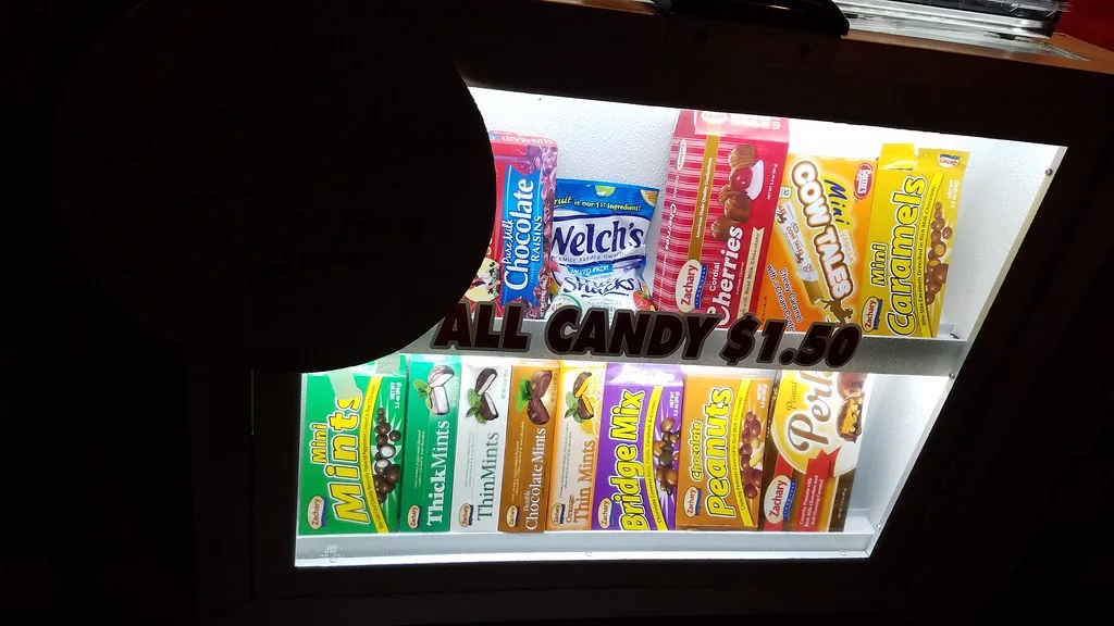 Cinema candy packages displayed at a movie theater counter