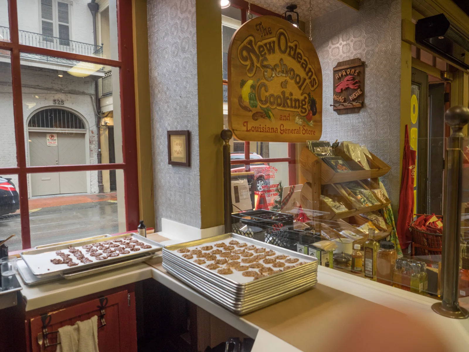 Trays of round pecan pralines in a New Orleans cooking-shop window