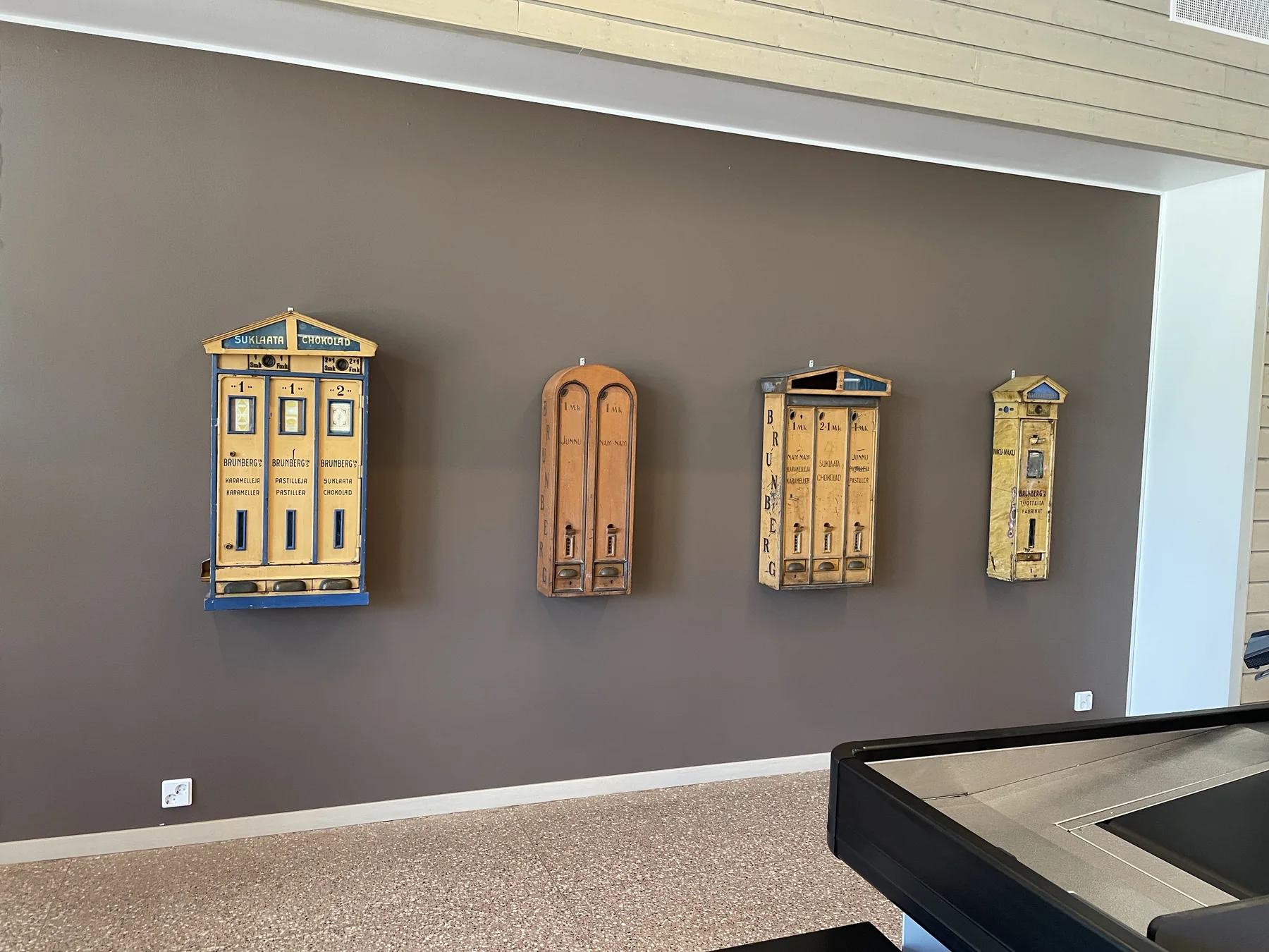 Rows of antique chocolate and candy vending machines